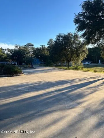 a view of a chairs and table in a patio