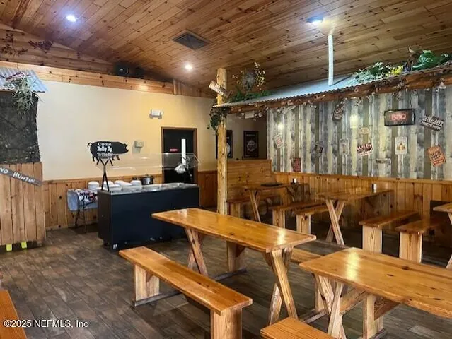 a view of a swimming pool with seating space