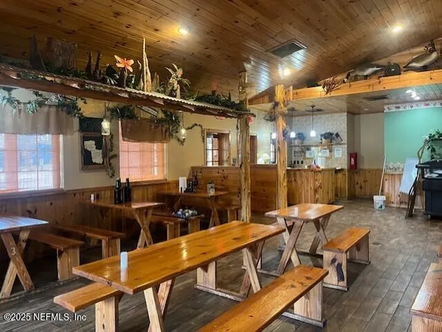 a view of a swimming pool with outdoor seating