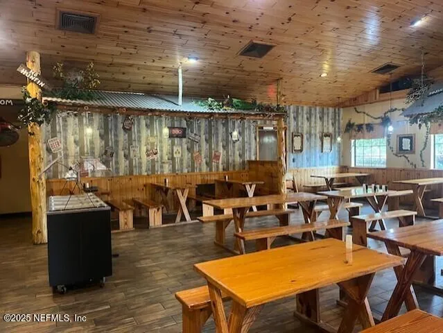a very nice looking living room with dining room and couches