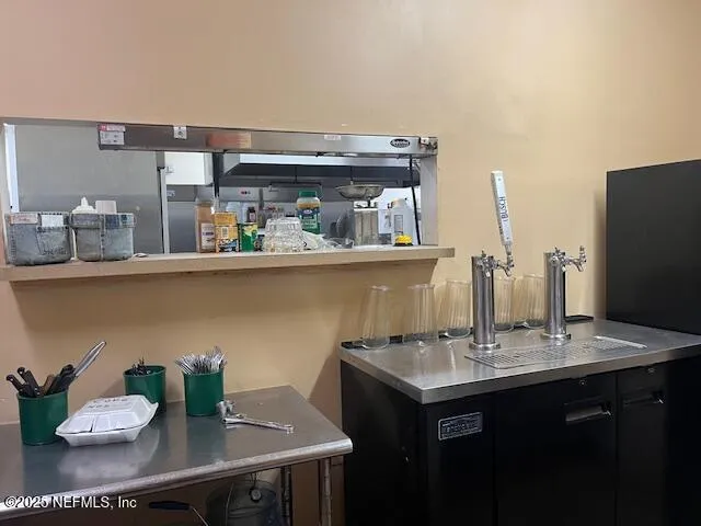 a kitchen with a stove and cabinets