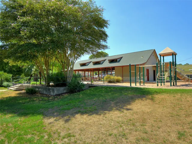 a sign that is in front of flowers