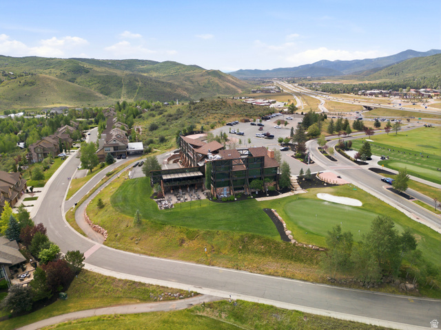 3535 Homestead Road Park City, UT 84098 - Photo 80 of 81 Mountainous terrain with a multi-story building featuring a prominent outdoor patio area