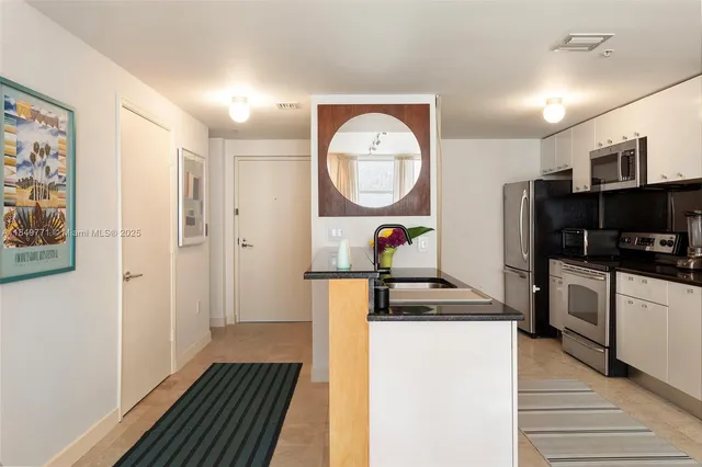 a large living room with furniture and a flat screen tv
