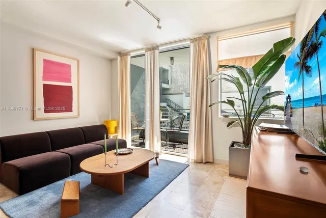 a outdoor dining space with furniture and a potted plant