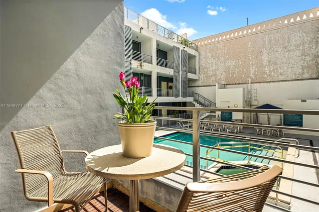 a view of a swimming pool with a lounge chairs