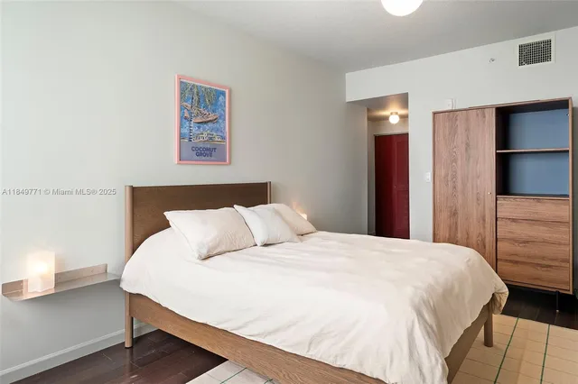 a view of walk in closet and clothes