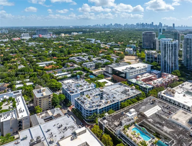 a front view of building with yard and outdoor seating