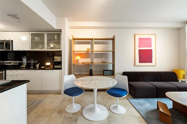 a kitchen with stainless steel appliances granite countertop a sink and cabinets