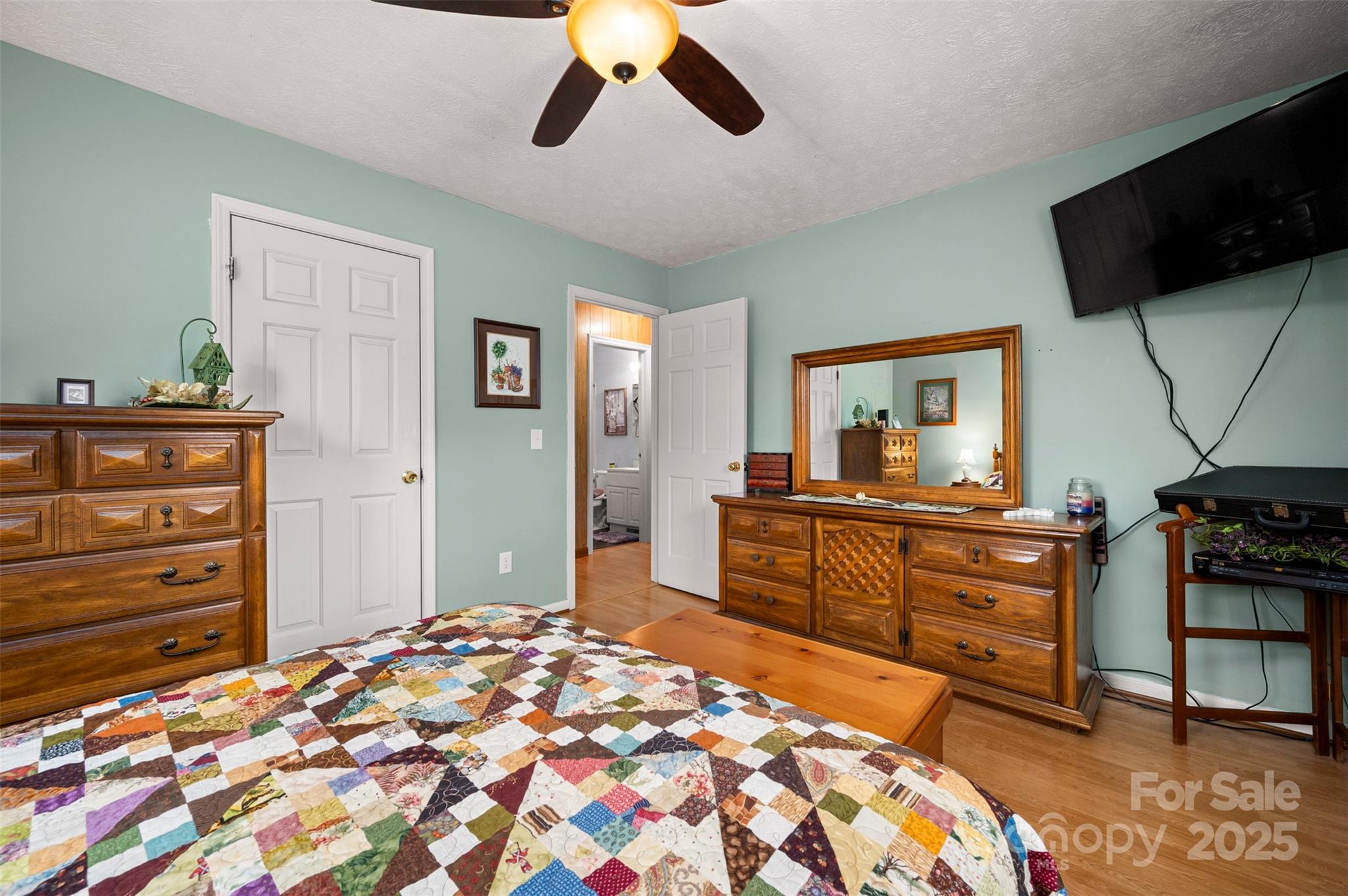 790 County Line Road Rutherfordton, NC 28139 - Photo 11 of 36 a bedroom with a bed and a flat screen tv