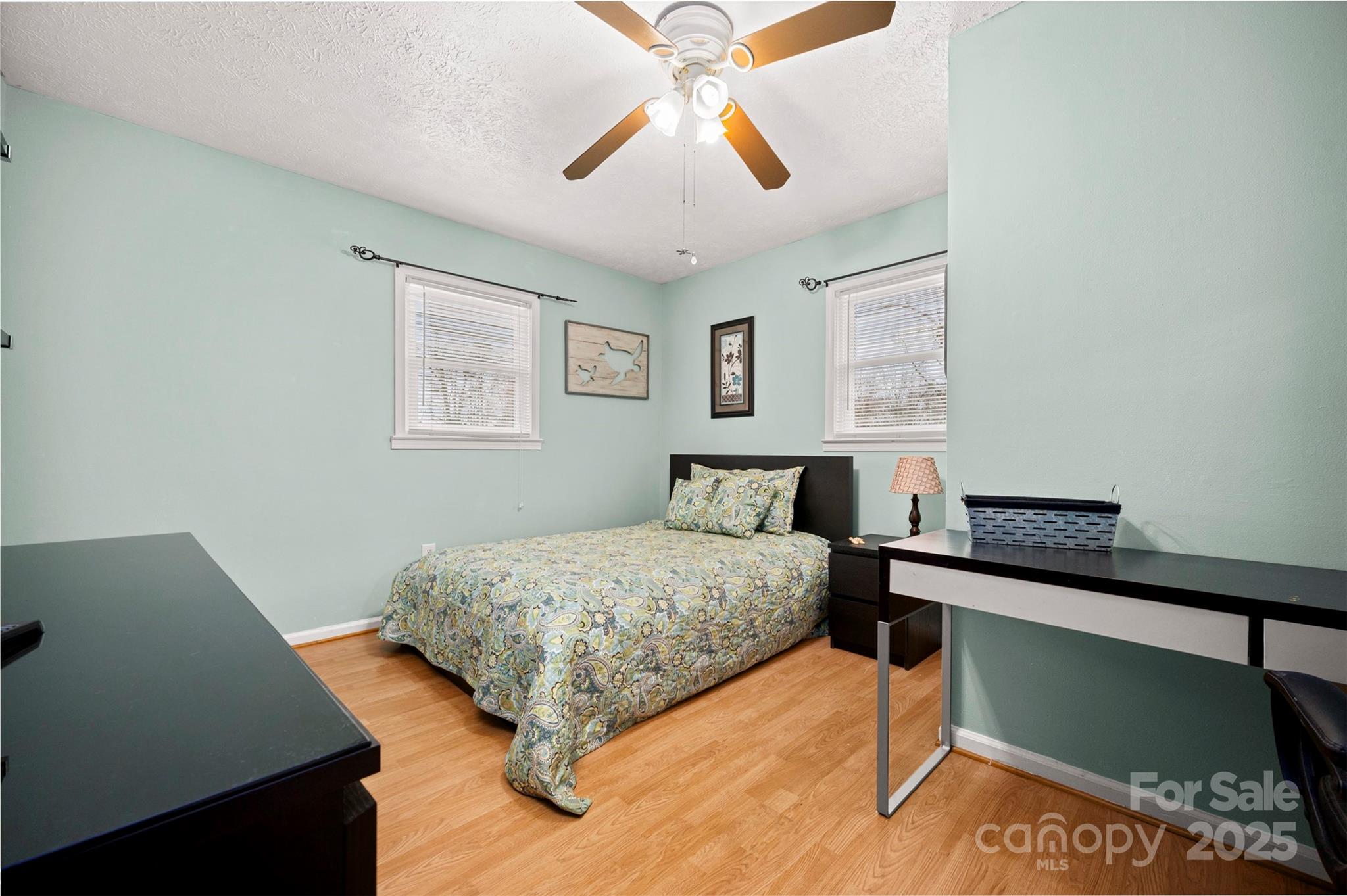 790 County Line Road Rutherfordton, NC 28139 - Photo 14 of 36 a bedroom with a bed and a chandelier