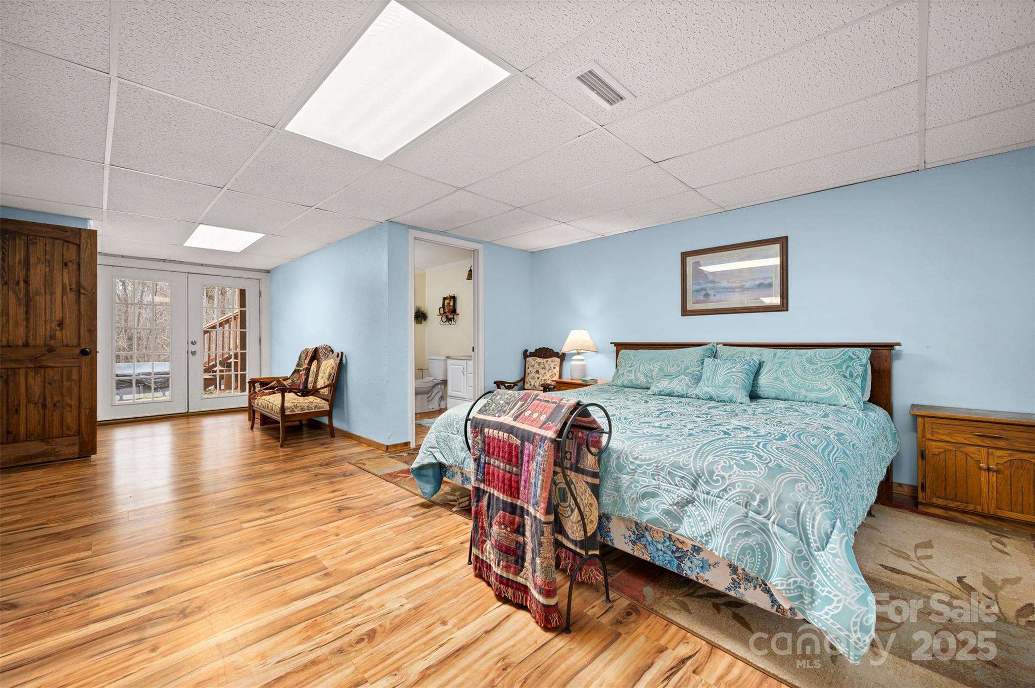 790 County Line Road Rutherfordton, NC 28139 - Photo 19 of 36 a bedroom with a bed and wooden floor