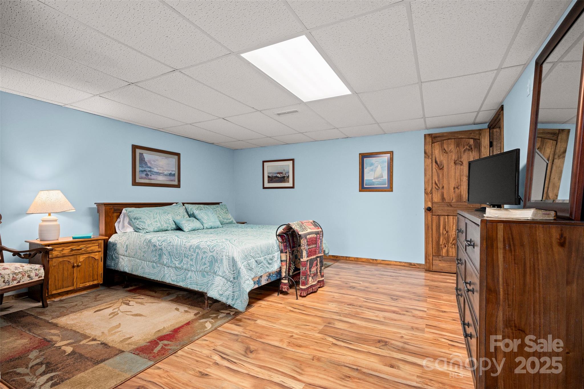 790 County Line Road Rutherfordton, NC 28139 - Photo 21 of 36 a spacious bedroom with a bed and a flat screen tv