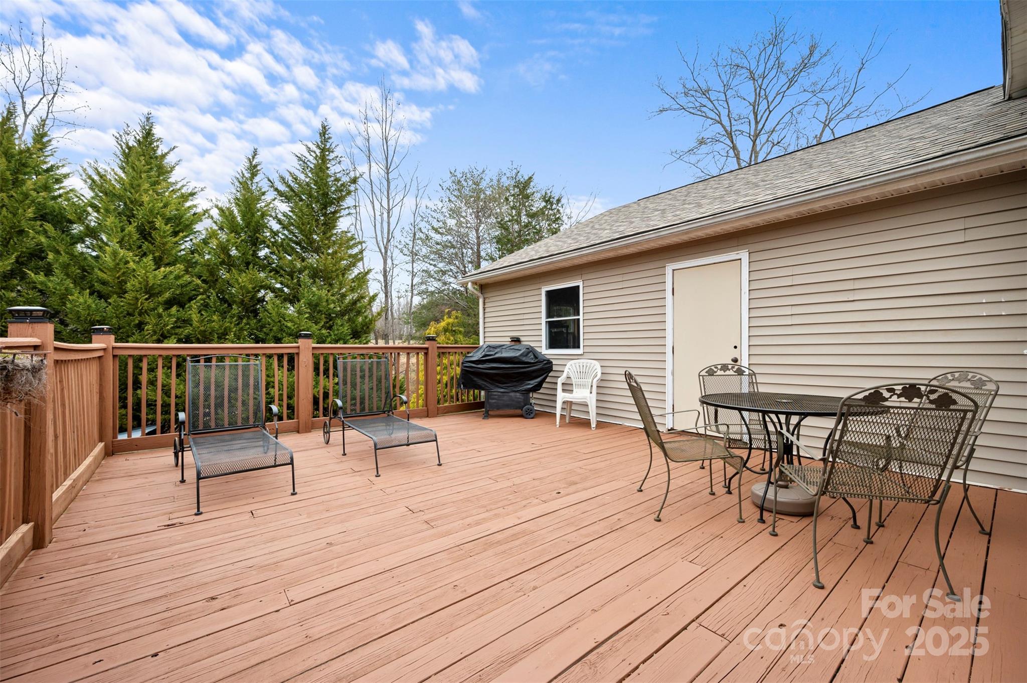 790 County Line Road Rutherfordton, NC 28139 - Photo 29 of 36 a view of a roof deck with table and chairs and wooden floor
