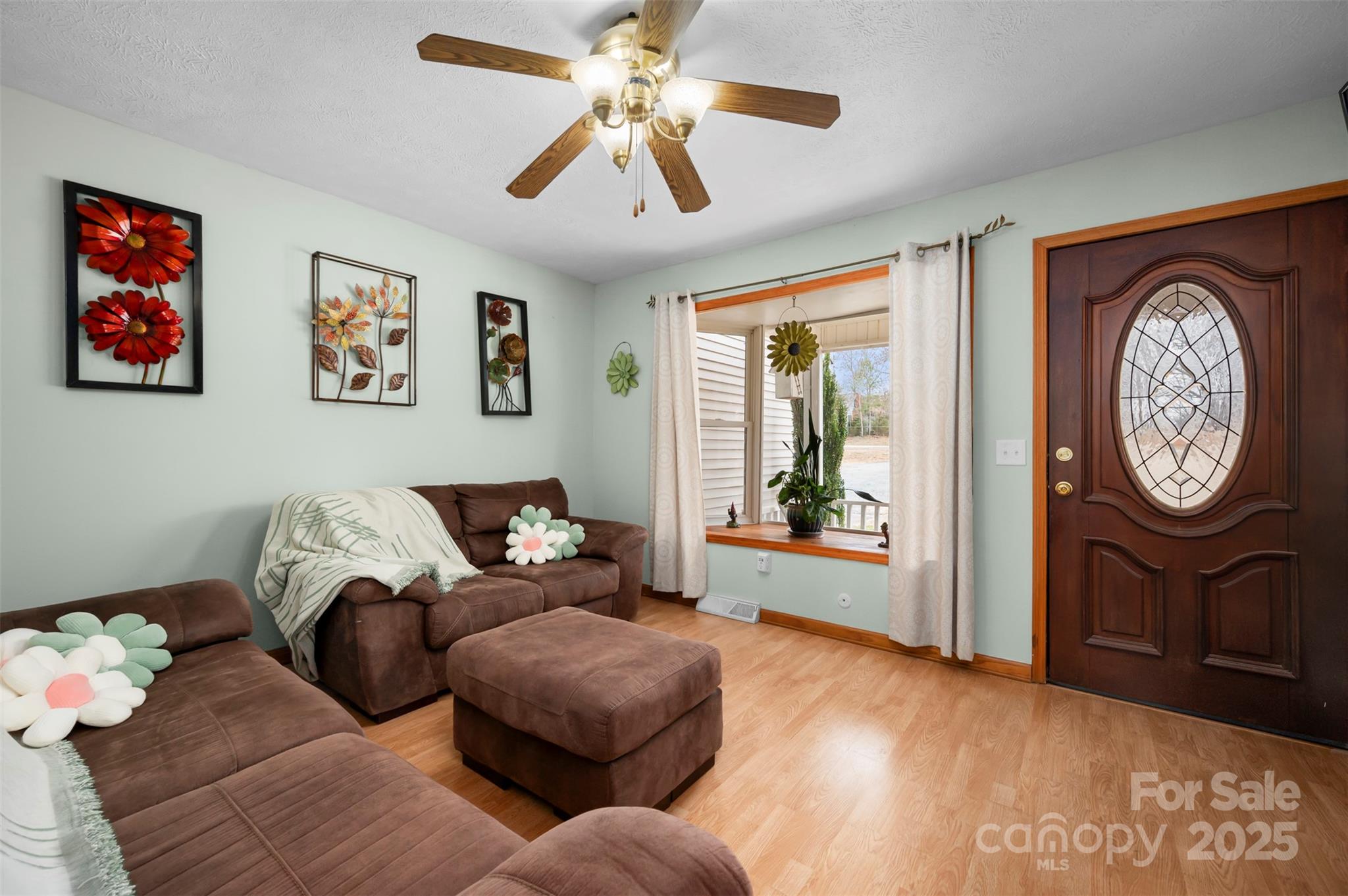 790 County Line Road Rutherfordton, NC 28139 - Photo 3 of 36 a living room with furniture a window and a chandelier