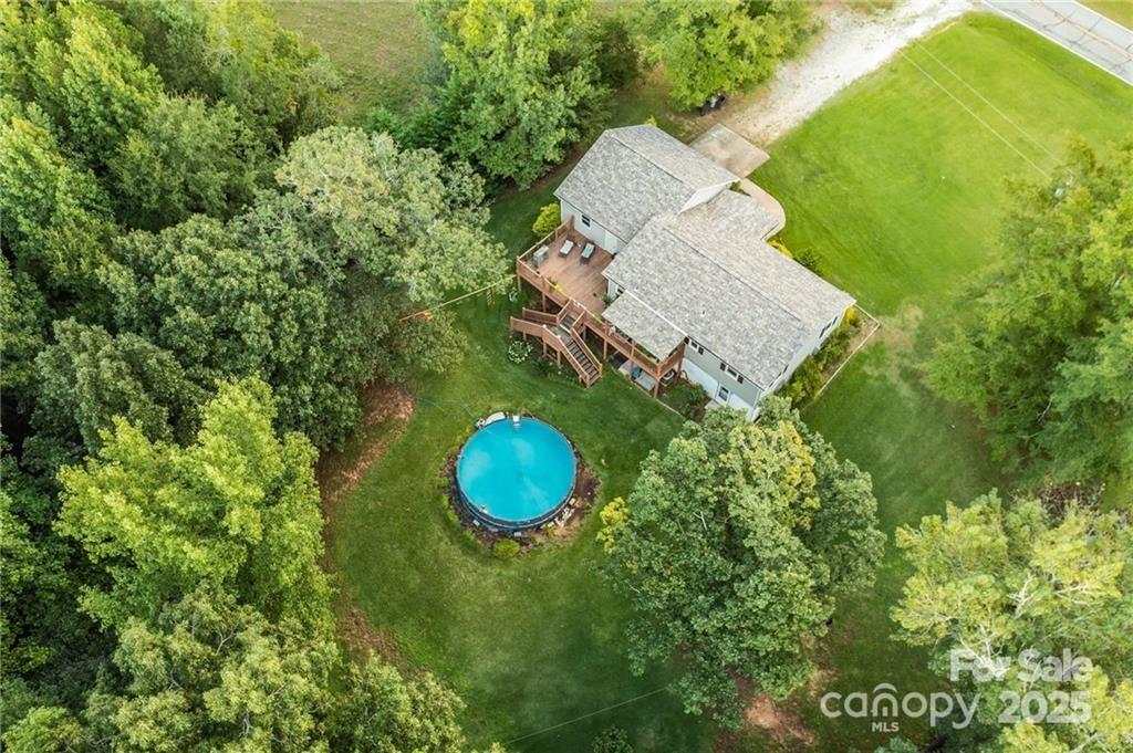 790 County Line Road Rutherfordton, NC 28139 - Photo 35 of 36 an aerial view of a house with a swimming pool and garden