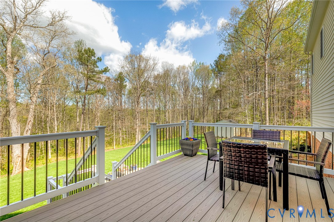 14436 Overlook Ridge Lane Beaverdam, VA 23015 - Photo 57 of 82 a view of a balcony with furniture and wooden floor