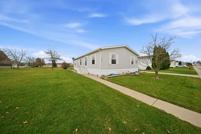 a view of a house with a big yard