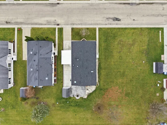 a view of a brick wall in front of a building