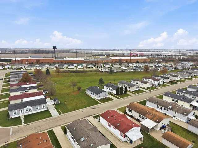 an aerial view of a city with ocean view