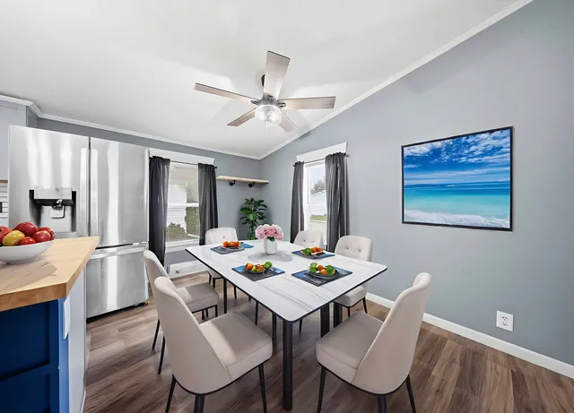 a view of a dining room with furniture window and wooden floor