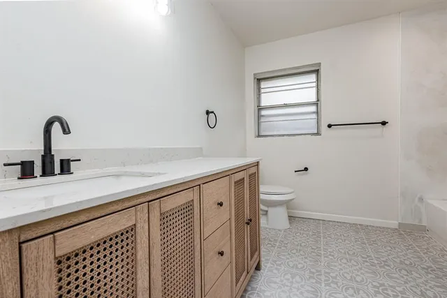 a bathroom with a sink and a toilet