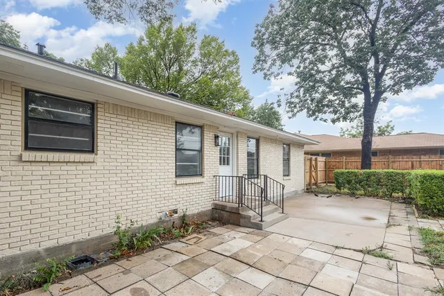 a backyard of a house with seating space