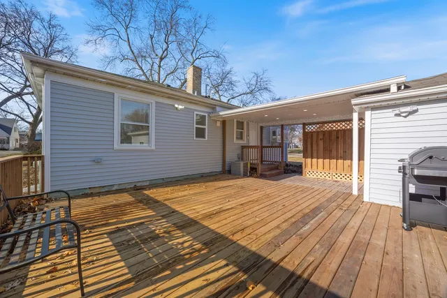 a view of backyard with a deck