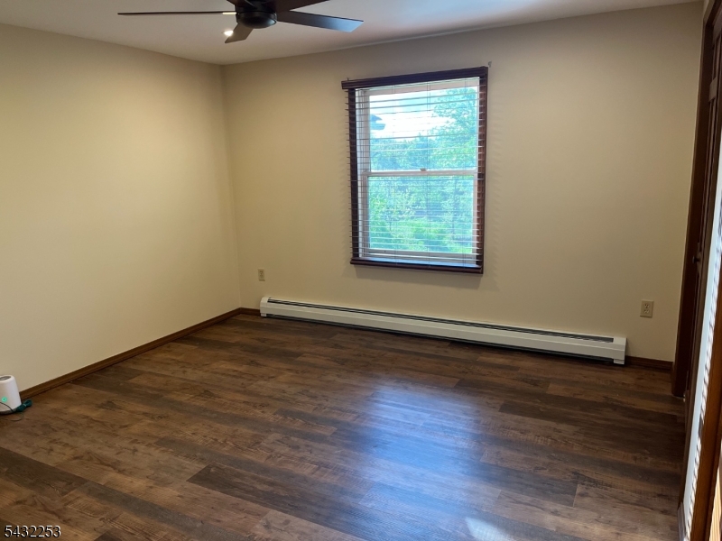 31 Countryside Road Columbia, NJ 07832 - Photo 10 of 31 an empty room with wooden floor and windows