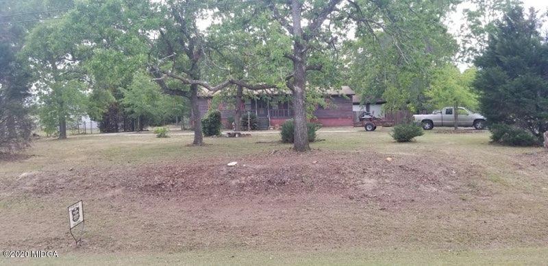 a view of a yard with tree s