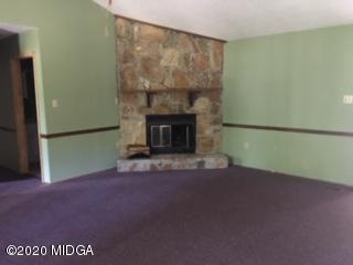 3623 Tidwell Road Lizella, GA 31052 - Photo 5 of 12 a view of empty room with a fireplace