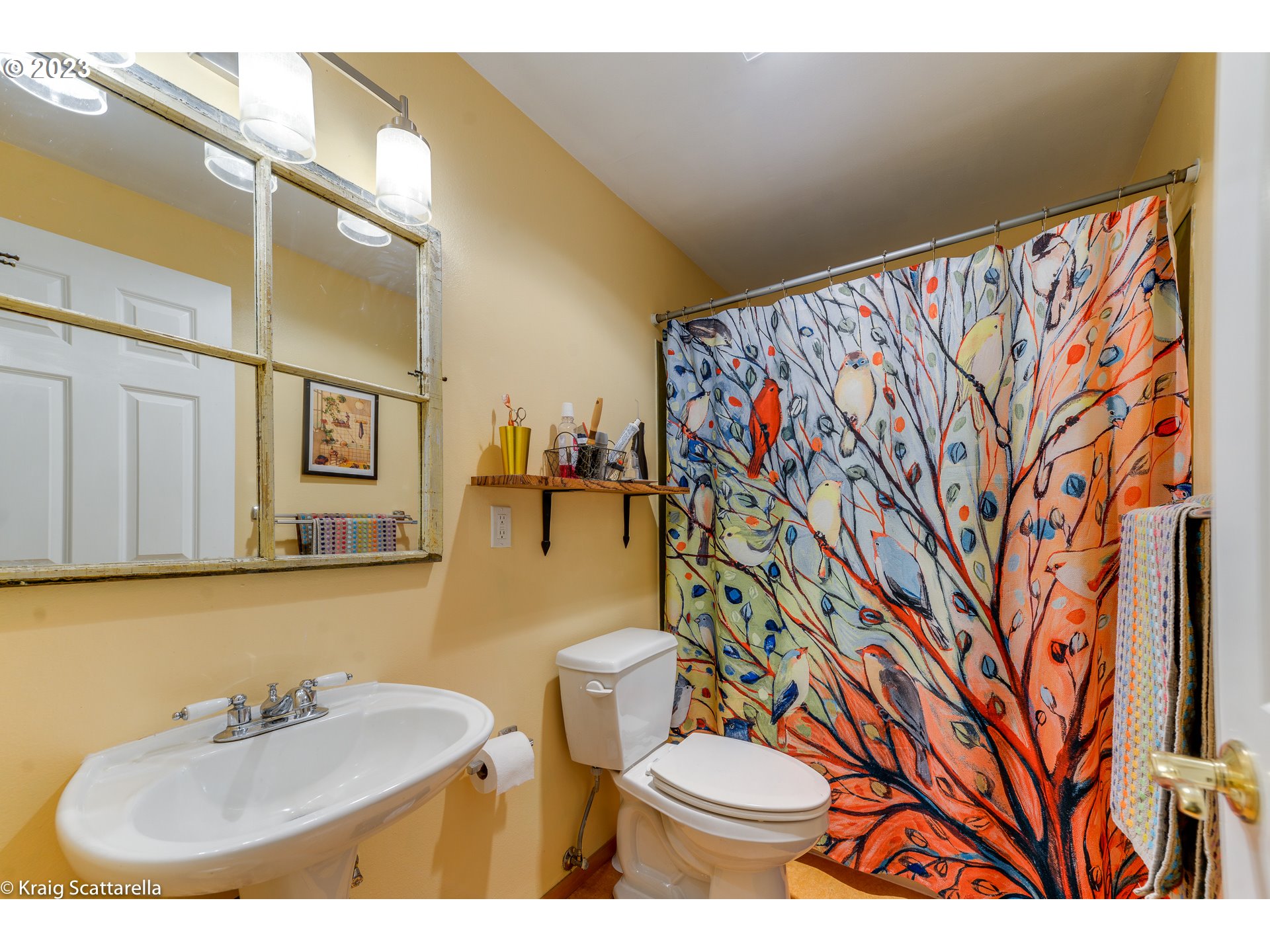 5109 Southwest Boundary Street Portland, OR 97221 - Photo 11 of 20 a bathroom with a toilet sink and mirror