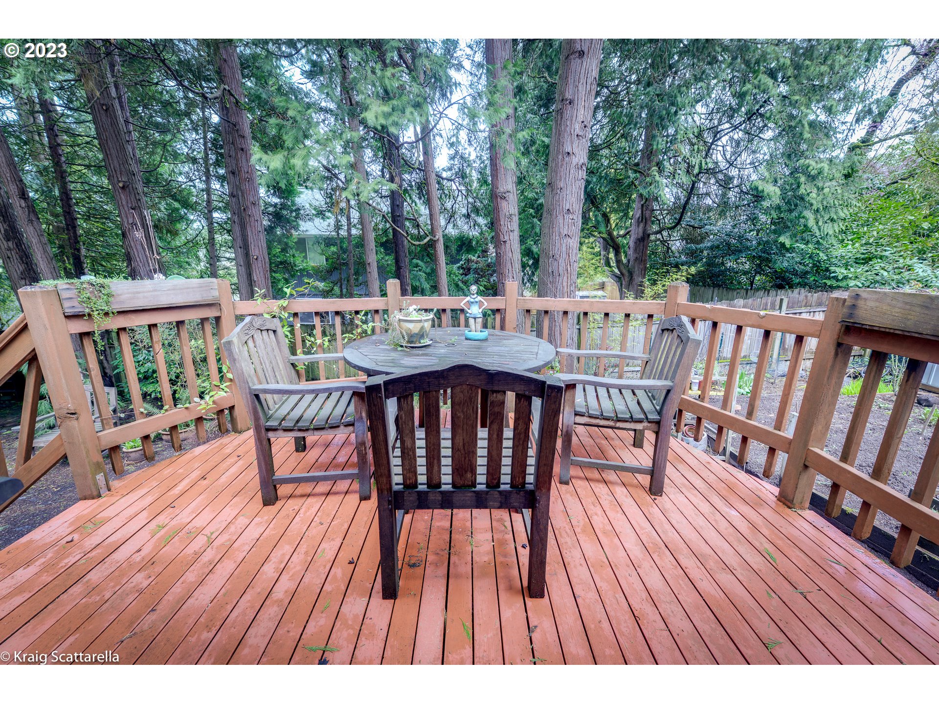 5109 Southwest Boundary Street Portland, OR 97221 - Photo 13 of 20 a balcony with wooden floor outdoor seating and yard in the back