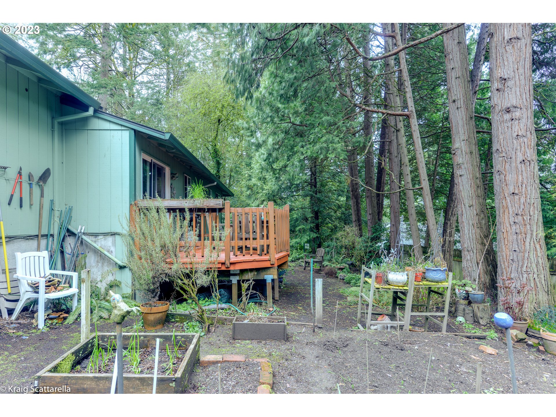 5109 Southwest Boundary Street Portland, OR 97221 - Photo 15 of 20 a backyard of a house with table and chairs