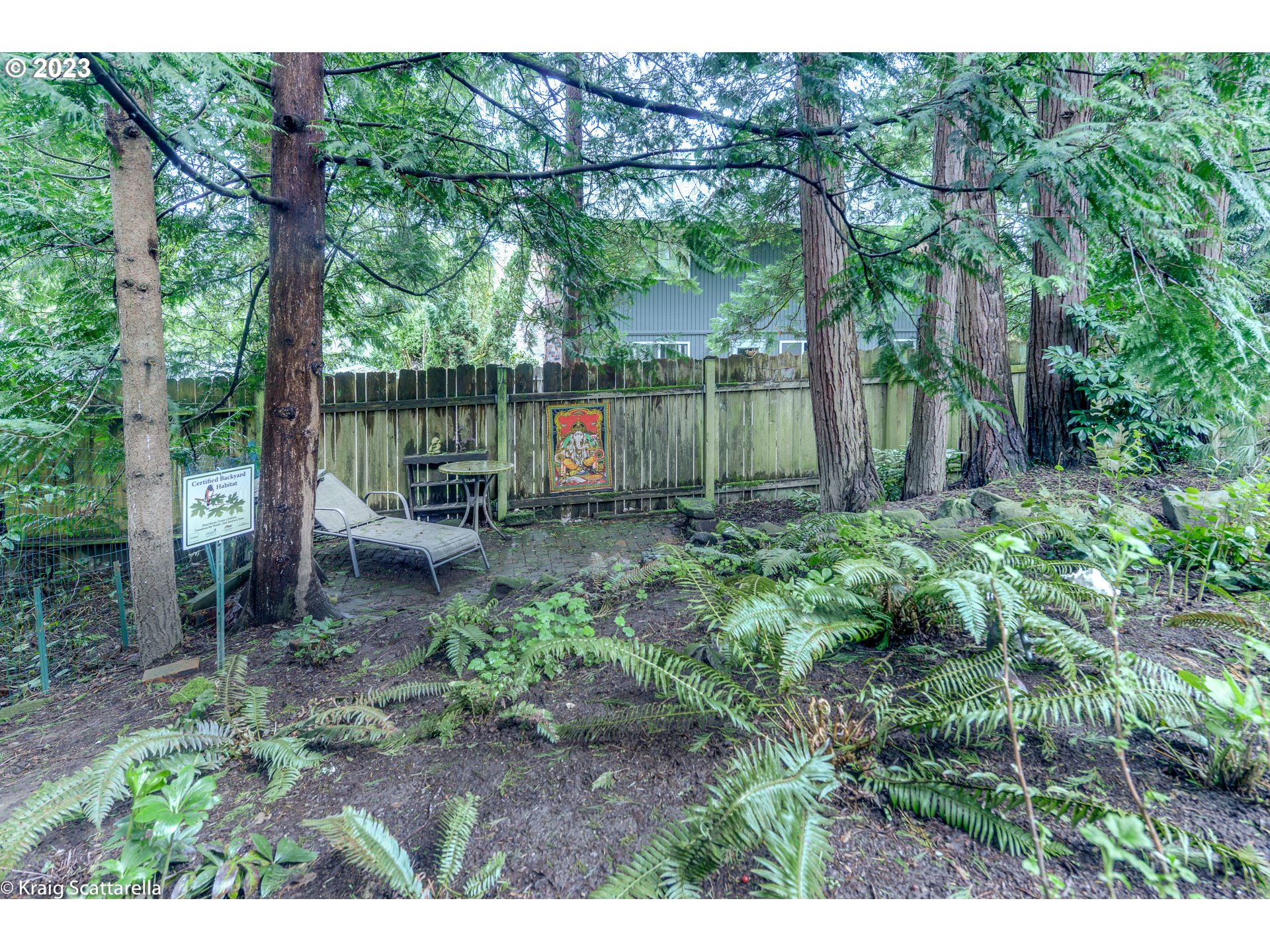 5109 Southwest Boundary Street Portland, OR 97221 - Photo 16 of 20 a backyard of a house with lots of green space