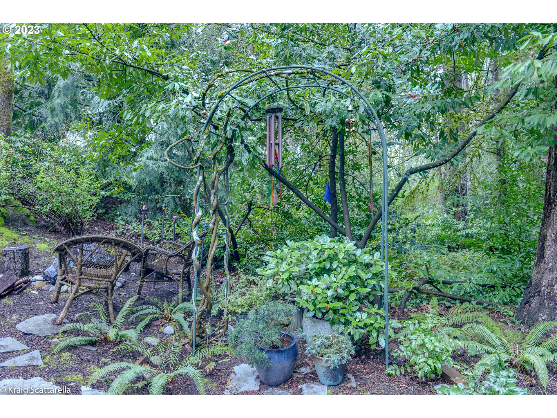 5109 Southwest Boundary Street Portland, OR 97221 - Photo 19 of 20 a backyard of a house with table and chairs