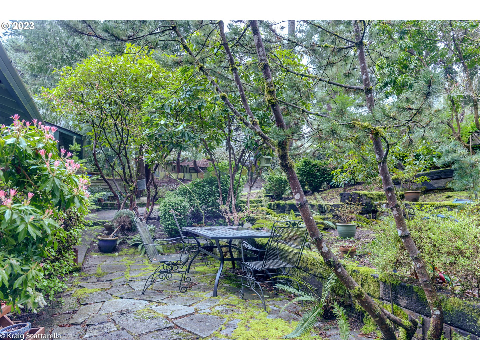 5109 Southwest Boundary Street Portland, OR 97221 - Photo 20 of 20 a backyard of a house with table and chairs