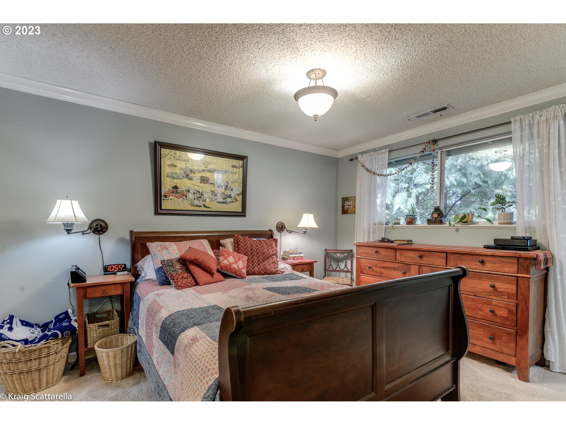 5109 Southwest Boundary Street Portland, OR 97221 - Photo 6 of 20 a bedroom with a bed and a lamp with window