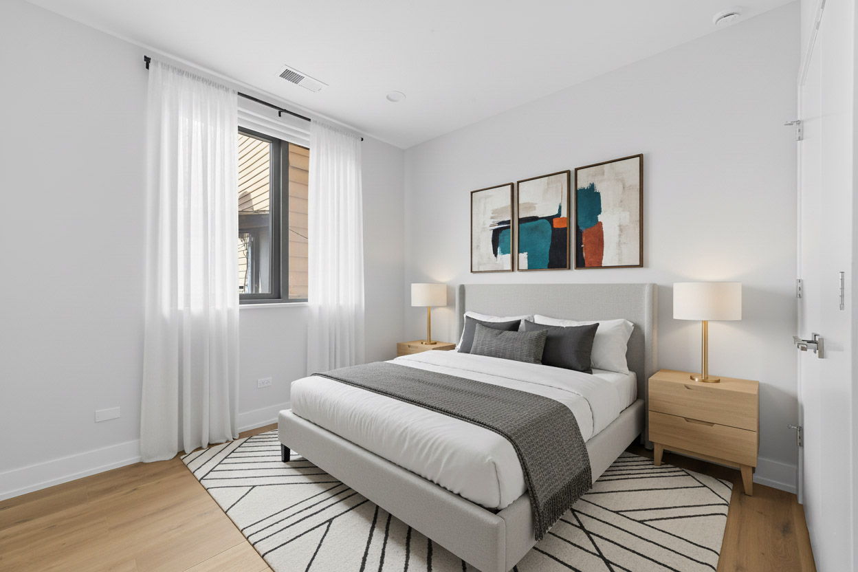 2354 North Washtenaw Avenue, Unit 304 Chicago, IL 60647 - Photo 7 of 16 a bedroom with a bed and a window
