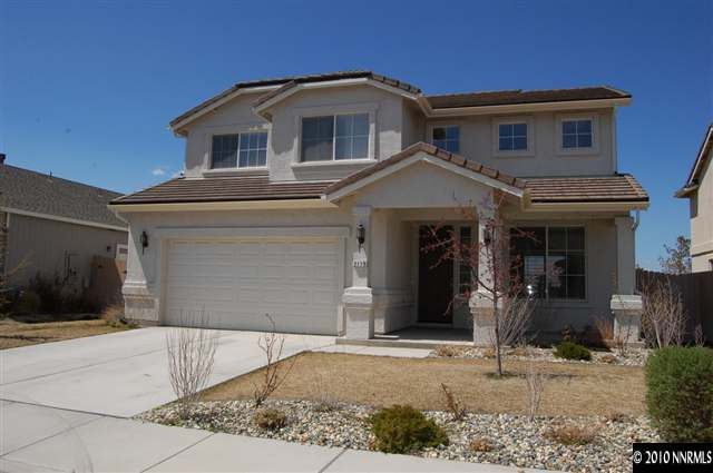 2175 Evergreen Park Drive Reno, NV 89521 - Photo 1 of 9 a front view of a house with a yard and garage
