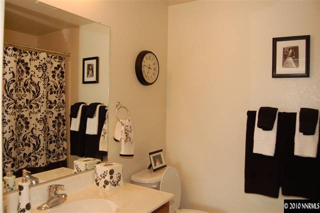 2175 Evergreen Park Drive Reno, NV 89521 - Photo 8 of 9 a bathroom with a sink and a mirror