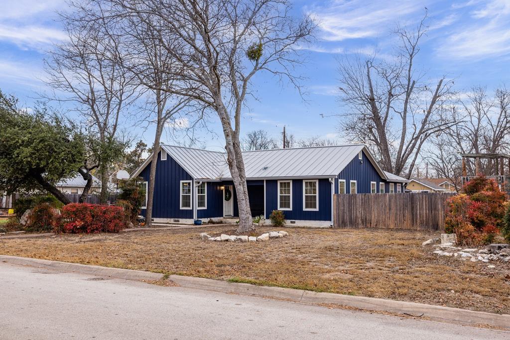 414 Ruth Street Kerrville, TX 78028 - Photo 1 of 19 a front view of a house with a yard covered in snow