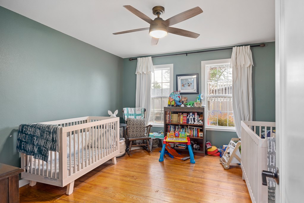414 Ruth Street Kerrville, TX 78028 - Photo 14 of 19 a bedroom with furniture and a window
