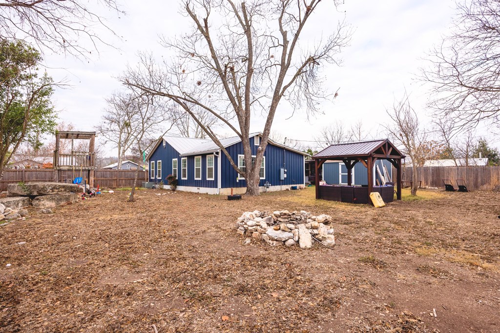 414 Ruth Street Kerrville, TX 78028 - Photo 18 of 19 a front view of a house with a yard covered in snow