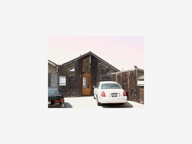 a car parked in front of a house