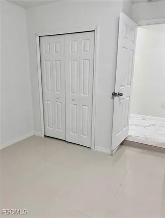 a bathroom with a glass door shower and a toilet