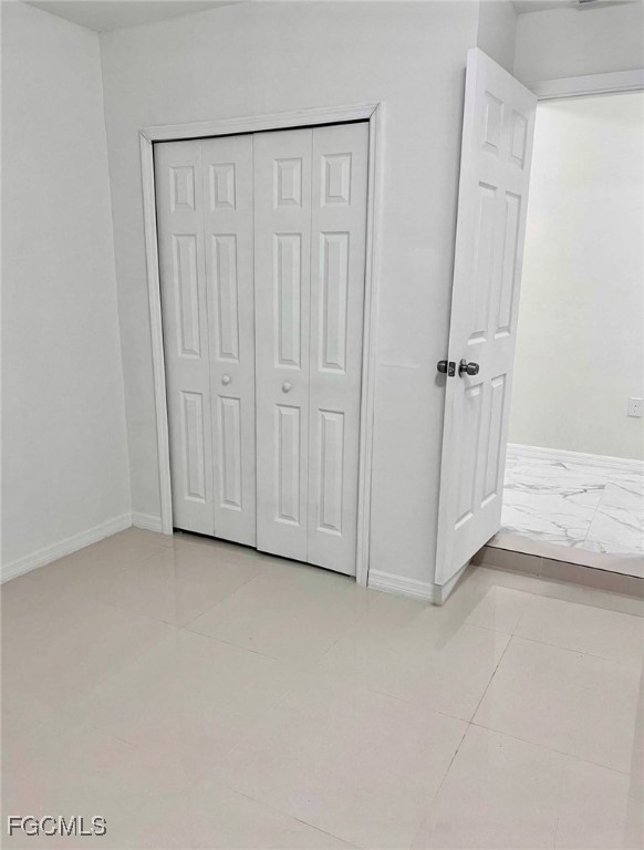 2209-2211 Park Road Lehigh Acres, FL 33971 - Photo 5 of 7 an empty room with a door