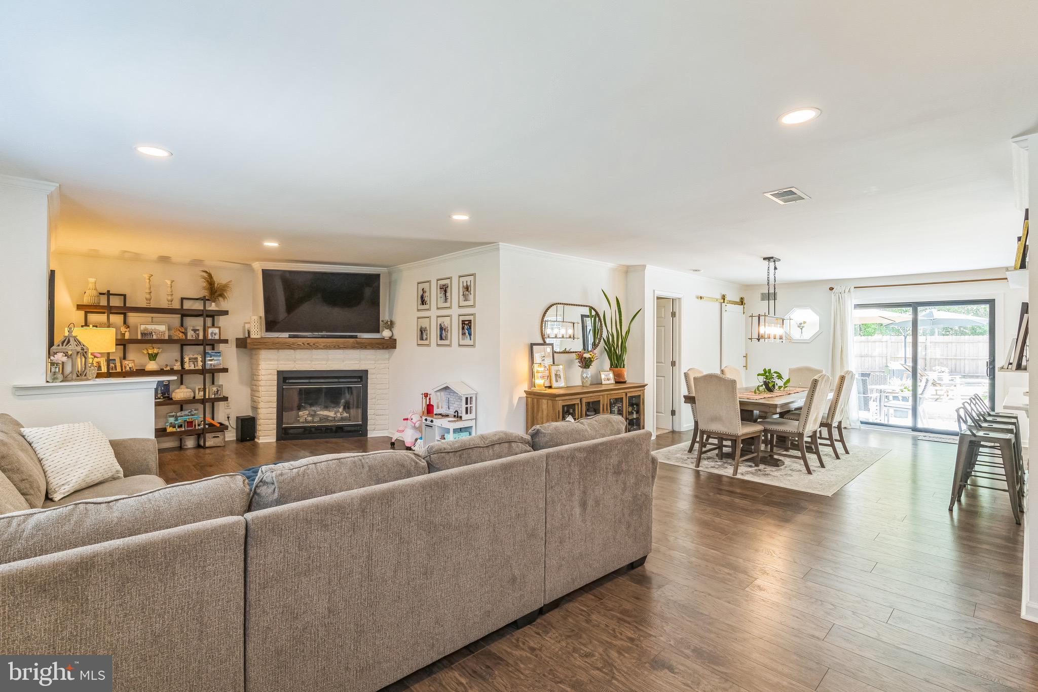 31 Hanover Road Marlton, NJ 08053 - Photo 3 of 15 a living room with furniture a fireplace and a flat screen tv