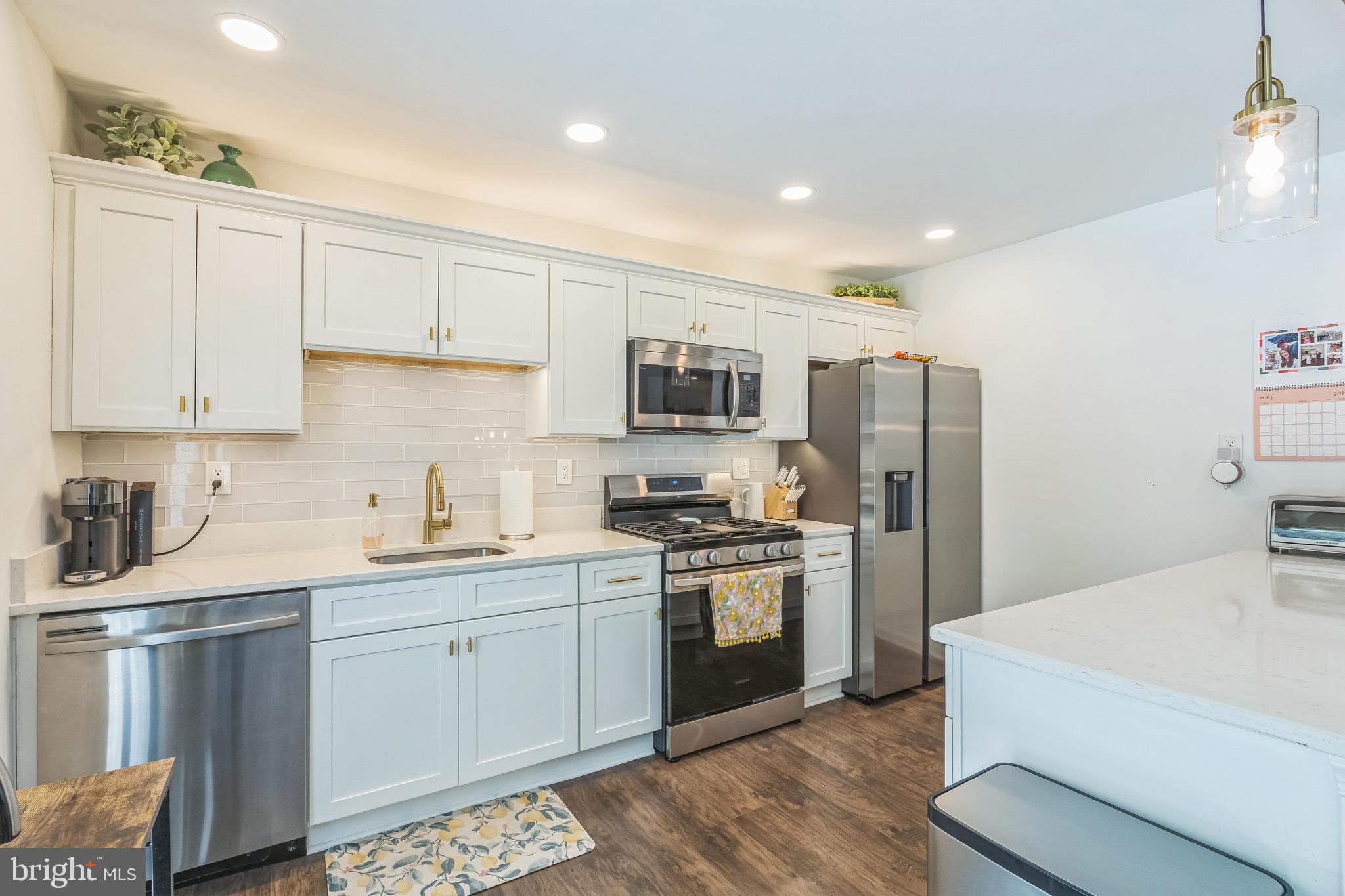 31 Hanover Road Marlton, NJ 08053 - Photo 6 of 15 a kitchen with a sink a stove a refrigerator and white cabinets