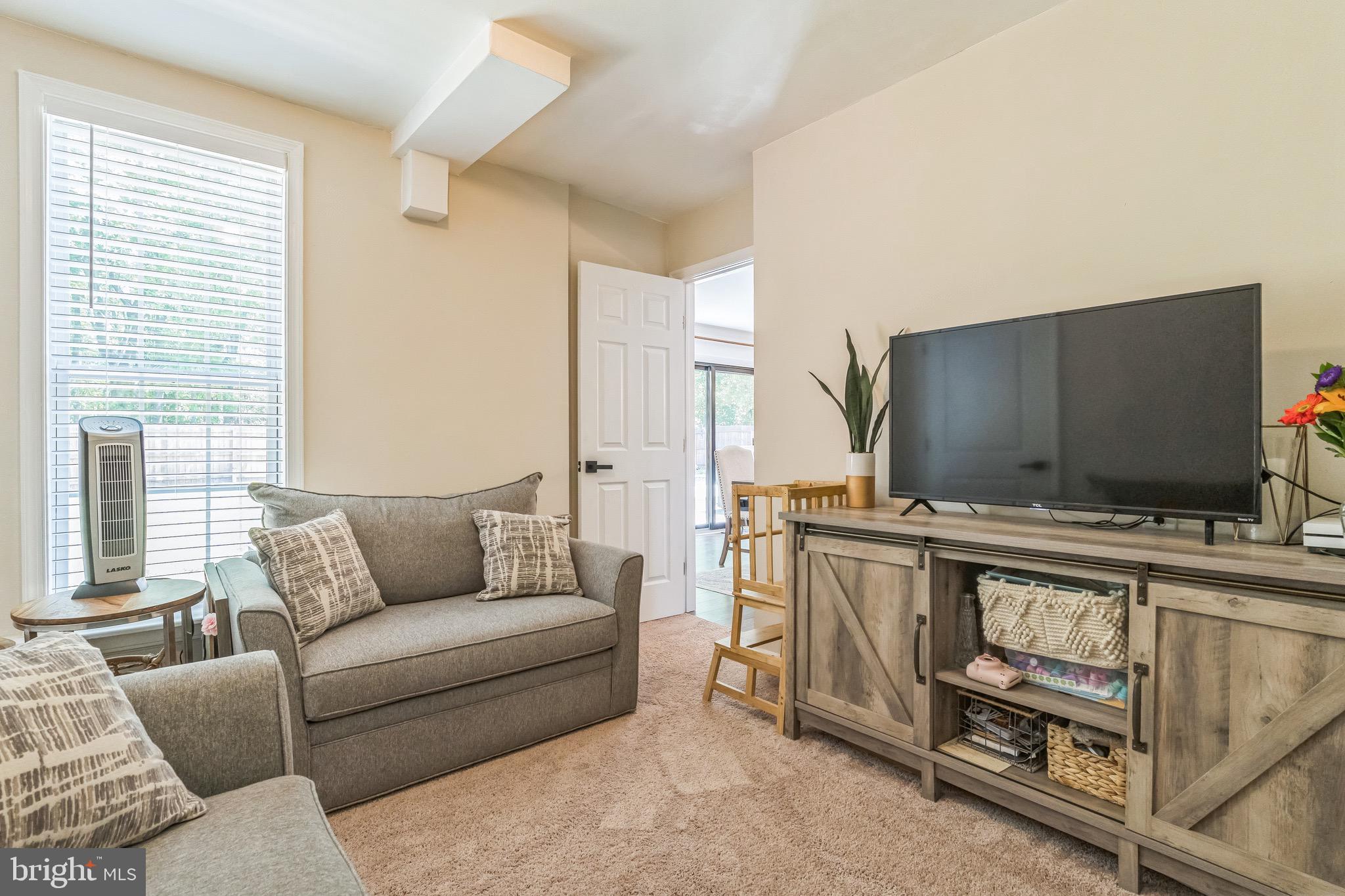 31 Hanover Road Marlton, NJ 08053 - Photo 7 of 15 a living room with furniture and a flat screen tv